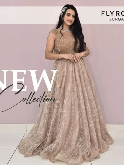 Check out my new collection. This shimmering champagne-colored gown is perfect for a cocktail party or a formal reception. It's pure elegance.