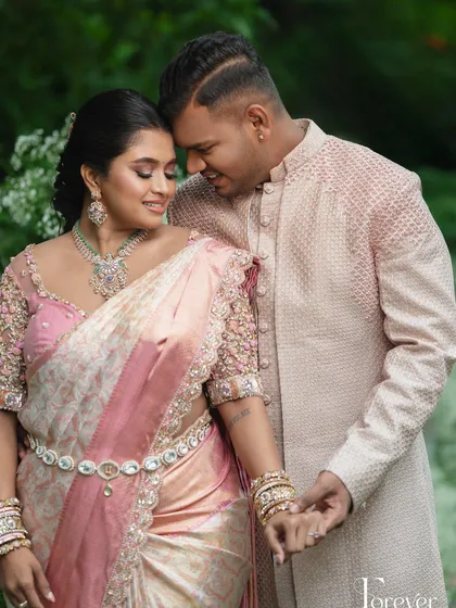 For this engagement, we chose a contemporary pastel pink sherwani. The textured fabric and subtle embroidery on the sleeves create a look that is modern, sophisticated, and effortlessly stylish, proving that groom's wear can be both classic and fresh.