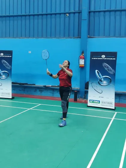 A player executing a backhand shot during a practice session. We conduct specialized drills to strengthen all aspects of a player's game, including their non-dominant strokes.