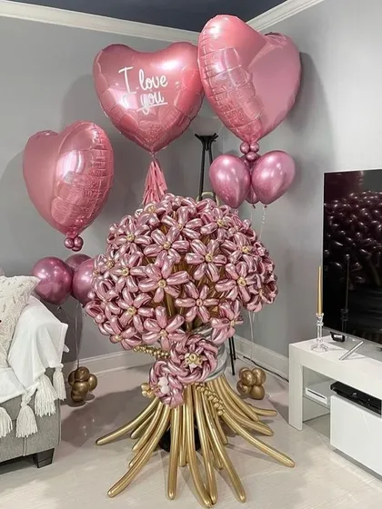 We love a creative challenge. This isn't a regular bouquet; it's a sculptural arrangement made entirely of balloons, designed to look like a giant bouquet of pink flowers. It's perfect for making a fun, unforgettable statement.