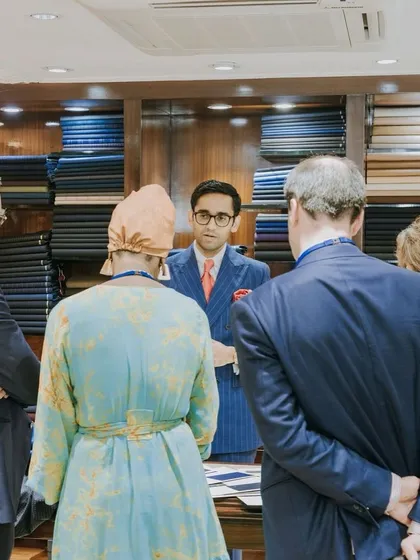 Presenting our craft to the Belgium Trade Commission. Our director explains the nuances of bespoke tailoring and our use of premium fabrics to an attentive audience of industry experts.