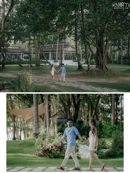 Walking together through the beautiful grounds of their resort in Phuket. This wide shot establishes the scene and captures a quiet, candid moment of togetherness.