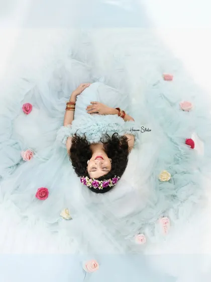 I love finding creative perspectives to tell your story. This artistic top-down photograph turns a beautiful moment into a piece of art, with the flowing gown and scattered flowers creating a dreamy, ethereal portrait.