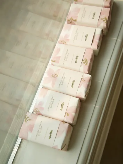 A line of the custom-wrapped soaps, ready to share the happy news.