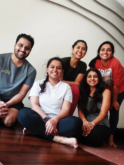 The energy in my in-person workshops is something special. This is us after an arm balance session in my Powai studio. We fall, we laugh, we support each other, and we all leave a little stronger and more confident. This is our community.