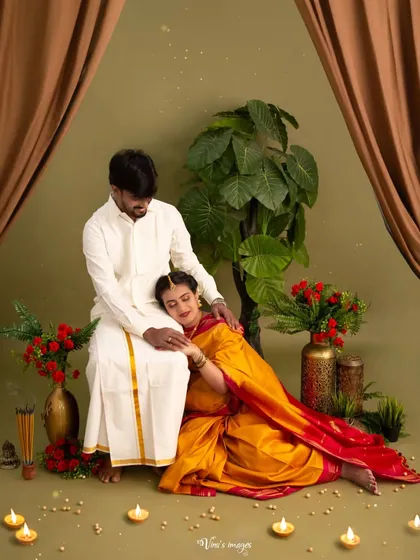 An intimate and restful pose, with the mother-to-be resting her head on her partner's lap. It's a quiet, loving moment that speaks volumes about their bond.