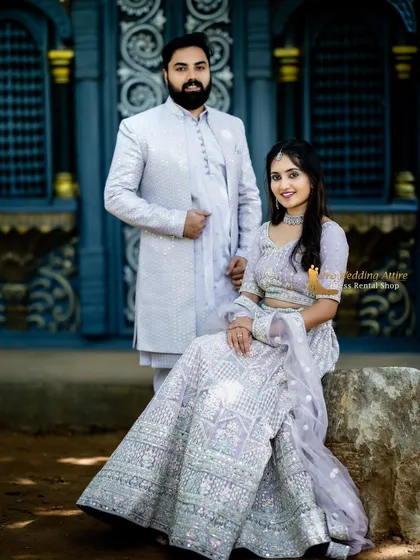 I specialize in creating coordinated looks for couples. This lavender lehenga with mirror work is perfectly matched with a custom-designed men's sherwani in the same color family. Renting a set like this ensures your outfits are perfectly synchronized for a polished look.