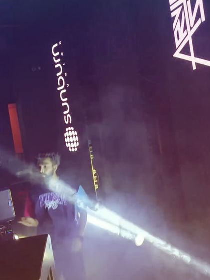 A candid shot of me at the decks, surrounded by smoke and light. It's in these moments that the music truly takes over.