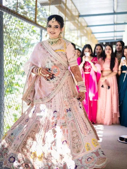 The bride's grand entry, with her bridesmaids looking on in admiration.