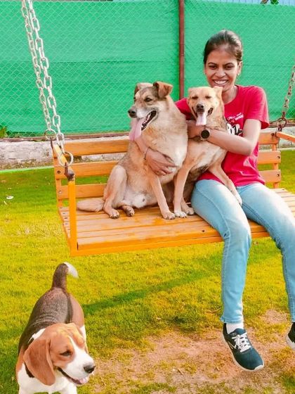 A beautiful family portrait on our swing. We are more than a boarding facility; we are a community for pet lovers.