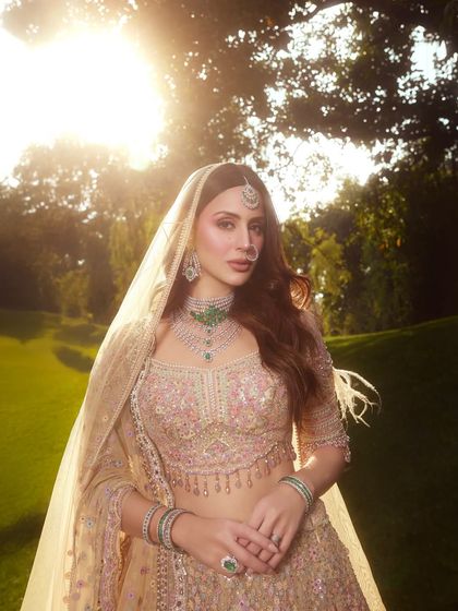 Golden hour perfection. This photo shows how the dewy makeup catches the light beautifully, creating a truly magical bridal portrait.