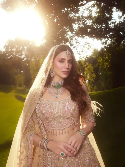 Golden hour perfection. This photo shows how the dewy makeup catches the light beautifully, creating a truly magical bridal portrait.