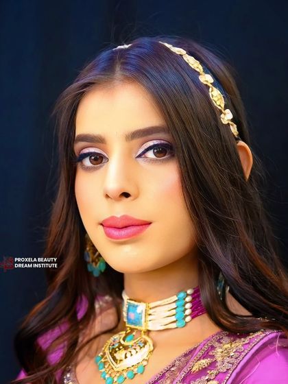 A direct, confident gaze. The winged eyeliner and bright inner corner highlight make the eyes the main focus of this stunning look.