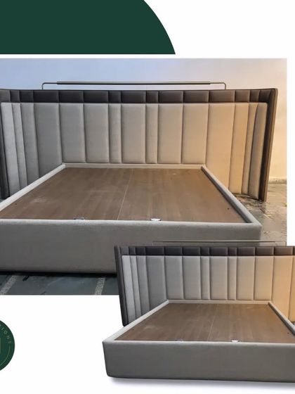 This bed features a tall, winged headboard with two-tone vertical paneling. The design creates a cozy, enclosed feeling while making a strong visual statement in the bedroom.