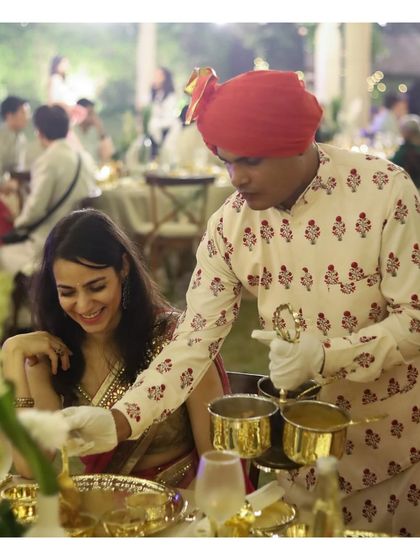 A joyful moment between our server and a guest during a traditional sit down dinner. We pride ourselves on providing service that is not only professional but also warm and engaging, ensuring a comfortable and happy atmosphere for everyone.