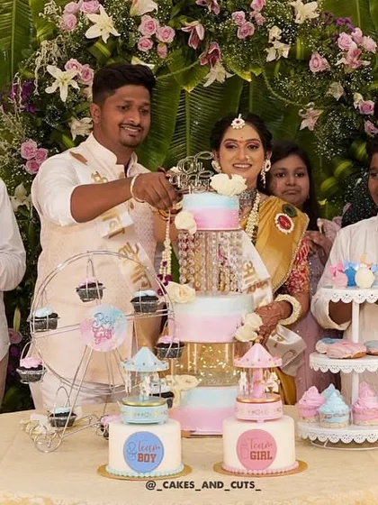 A baby shower is even more special with a full dessert table. Here we created a multi-tier cake, smaller themed cakes, cupcakes on a ferris wheel, and other treats, all coordinated for a beautiful "He or She" gender reveal party.