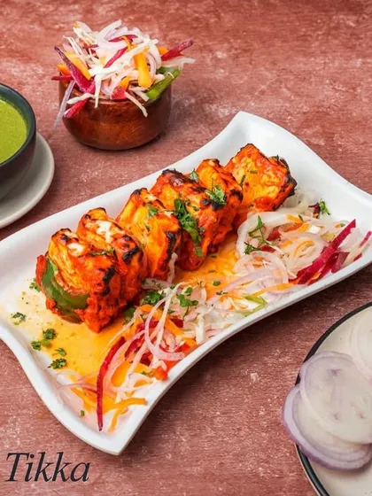 A classic vegetarian option, our Paneer Tikka. Soft paneer is marinated in traditional tandoori spices and grilled with vegetables for a smoky flavour.