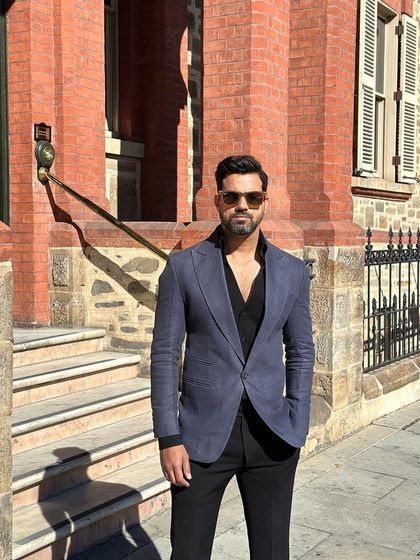 A confident look in our navy slim-fit blazer, a staple for any well-dressed man.