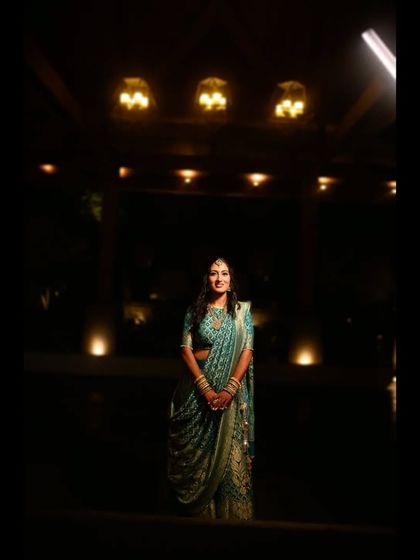 A dramatic, low-light portrait of the bride, using the ambient lighting to create a moody and elegant atmosphere.