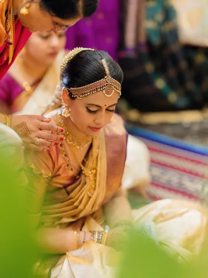 A quiet, contemplative moment, with the focus on her serene expression and the traditional details of her look.