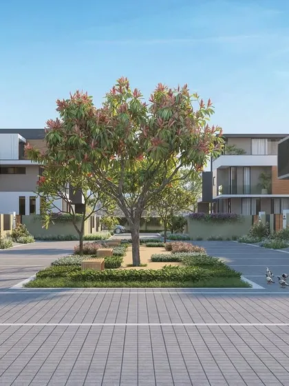 This tree-lined street is more than just an aesthetic choice. The trees provide shade, cool the air, and create a pleasant environment for pedestrians, embodying our commitment to integrating green spaces into the urban fabric.
