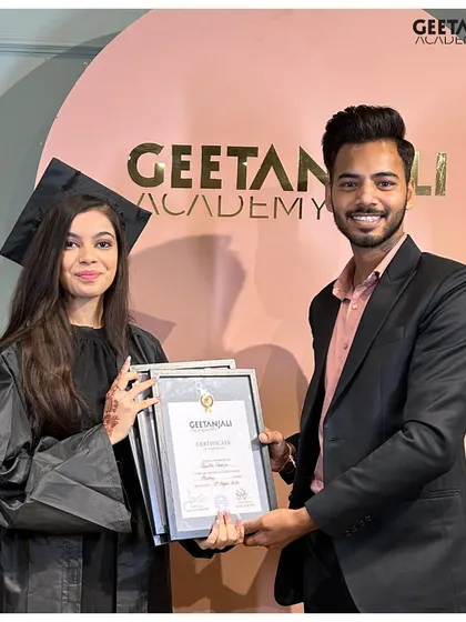 A proud moment for our graduate as she receives her hard-earned certificate. We are committed to shaping the next generation of beauty professionals.