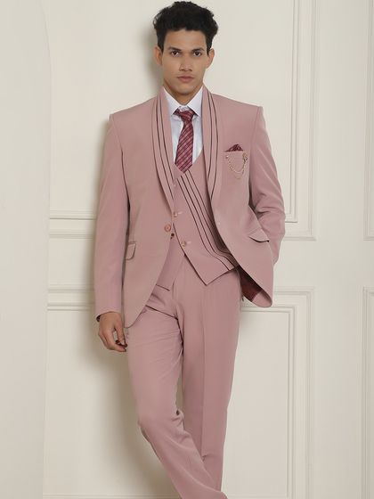 When the occasion is formal, wear a tailored suit. This three-piece suit in a pastel pink is a great example of our summer occasion wear.