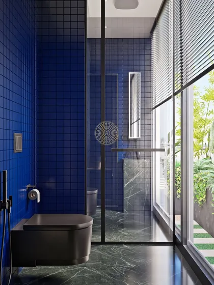 A full view of the guest bathroom, showing the floor-to-ceiling window that floods the space with natural light. The glass shower partition keeps the room feeling open and airy.