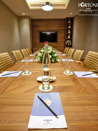 A close-up of the meeting essentials I provide. The custom-branded notepad and quality pen underscore the premium, detail-oriented service you can expect when hosting your business event with me.