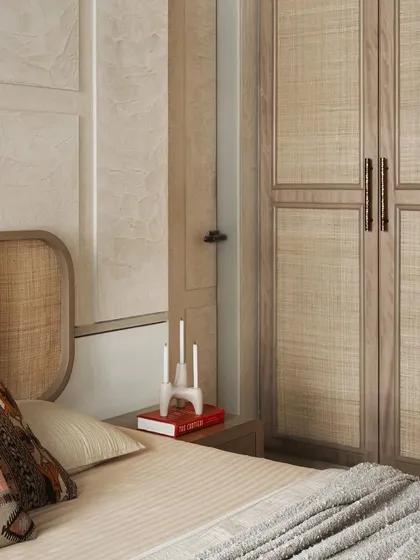 The wardrobe in the parents' room is crafted from ash grey veneer and cane, adding to the natural, serene look of the space.
