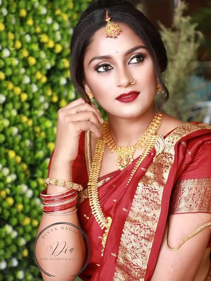 A beautiful three-quarter portrait from the same series. The lighting highlights her features and the rich colours of her outfit and makeup.