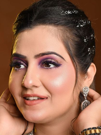 A beautiful engagement makeup look, complemented by our purple embroidered gown.