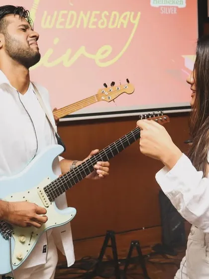 A fun moment between our guitarist and vocalist. We're not just a band, we're friends having a great time on stage, and that energy is infectious.