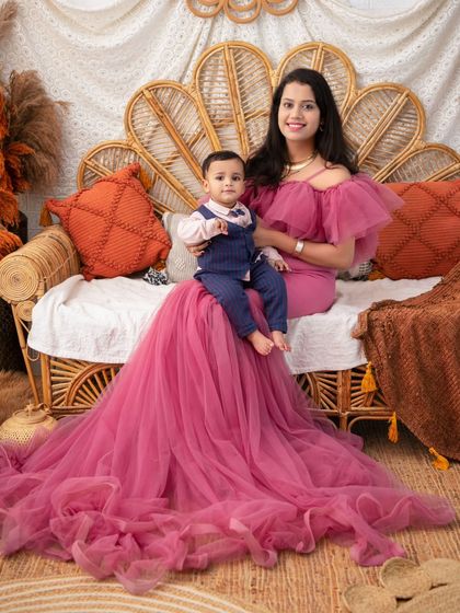 A mother and son portrait that feels like a royal painting. The flowing gown and elegant pose create a truly luxurious and memorable image.