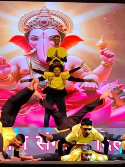 Our students performing an intricate human formation on stage at Talkatora Stadium. This acro yoga performance highlights the strength, balance, and unity we cultivate at our studio.