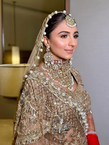 A fresh rosy glow for my gorgeous bride, Udita. She looks stunning in this golden Manish Malhotra lehenga with pearl detailing.