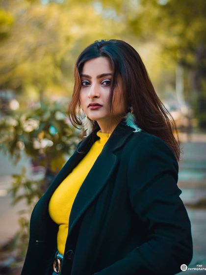 A classic outdoor portrait using a 50mm lens to create a beautiful blurred background, making the subject the complete focus.