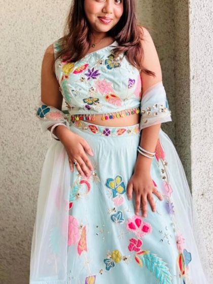 Another view of the pastel floral lehenga, showing how the light and airy fabric drapes beautifully.