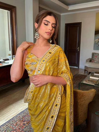 A pensive moment, showcasing the soft, shimmery eye makeup and the flawless, glowing skin.