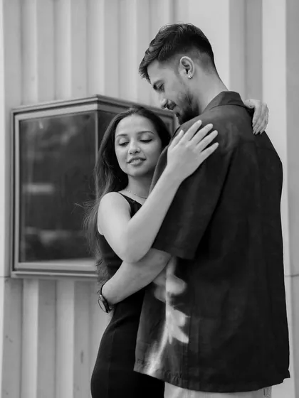A classic black and white portrait of the couple in a tender embrace. This style is perfect for conveying timeless romance and focusing purely on the emotional connection.