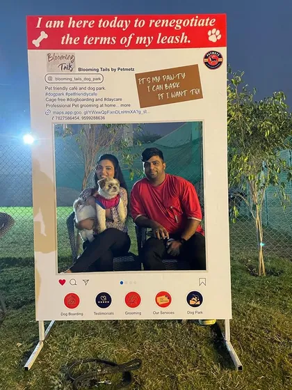 This adorable pup and their family are all smiles for the camera at our event photo booth.