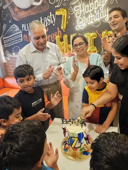 The birthday boy, Hriday, and his family celebrating with the custom Avengers cake. It's wonderful to see my creations bringing so much happiness.
