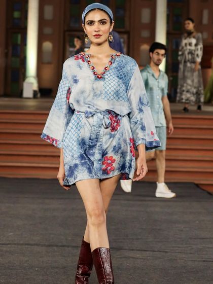 A collection from the 'Walking Hand in Hand' fashion show, where artisans share the spotlight with designers. This look, created with Liz Hartman, showcases pattern dye and discharge prints on handloom fabrics.