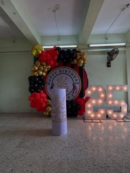 A wider shot of the RCB party setup, showing how it transforms the space and creates a dedicated photo zone for the celebration.