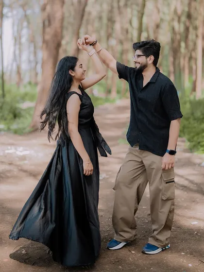 Pre-wedding shoots should be fun. Here, I captured a spontaneous dance in the middle of a forest path. It’s these unscripted, joyful moments that truly reflect a couple's personality and love for each other.