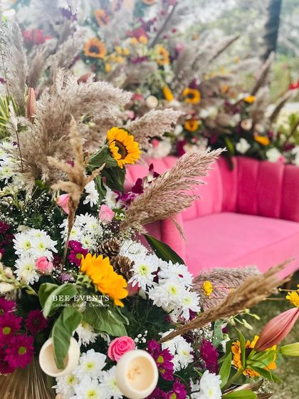 A close-up of the floral arrangements for a vibrant Mehendi setup. We used a mix of sunflowers, chrysanthemums, and pampas grass to create a rich, textured look that complements the festive atmosphere.
