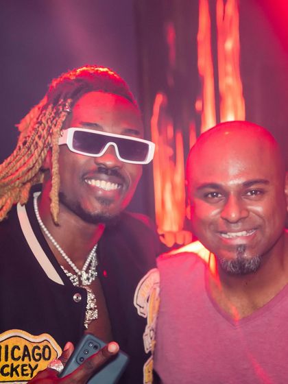 Posing with a guest who brought incredible energy and style to the party.