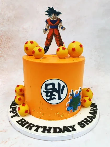 Power up your celebration with this Dragon Ball Z cake, featuring Goku, the iconic kanji symbol, and edible Dragon Balls.
