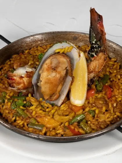 A personal-sized seafood paella, rich with mussels and prawns. This allows guests to enjoy our signature dish even if they are not in a large group.