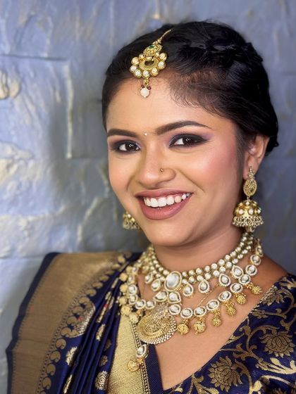 This smiling client is wearing a rented antique kundan set with a matching maang tikka, showing how versatile these pieces are for any traditional event.